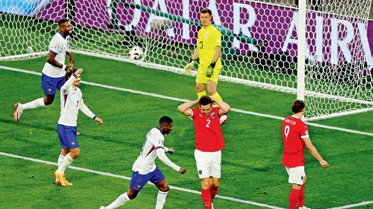 Austria’s Maximilian Woeber (second from left) is disappointed  after scoring an own-goal against France on Monday