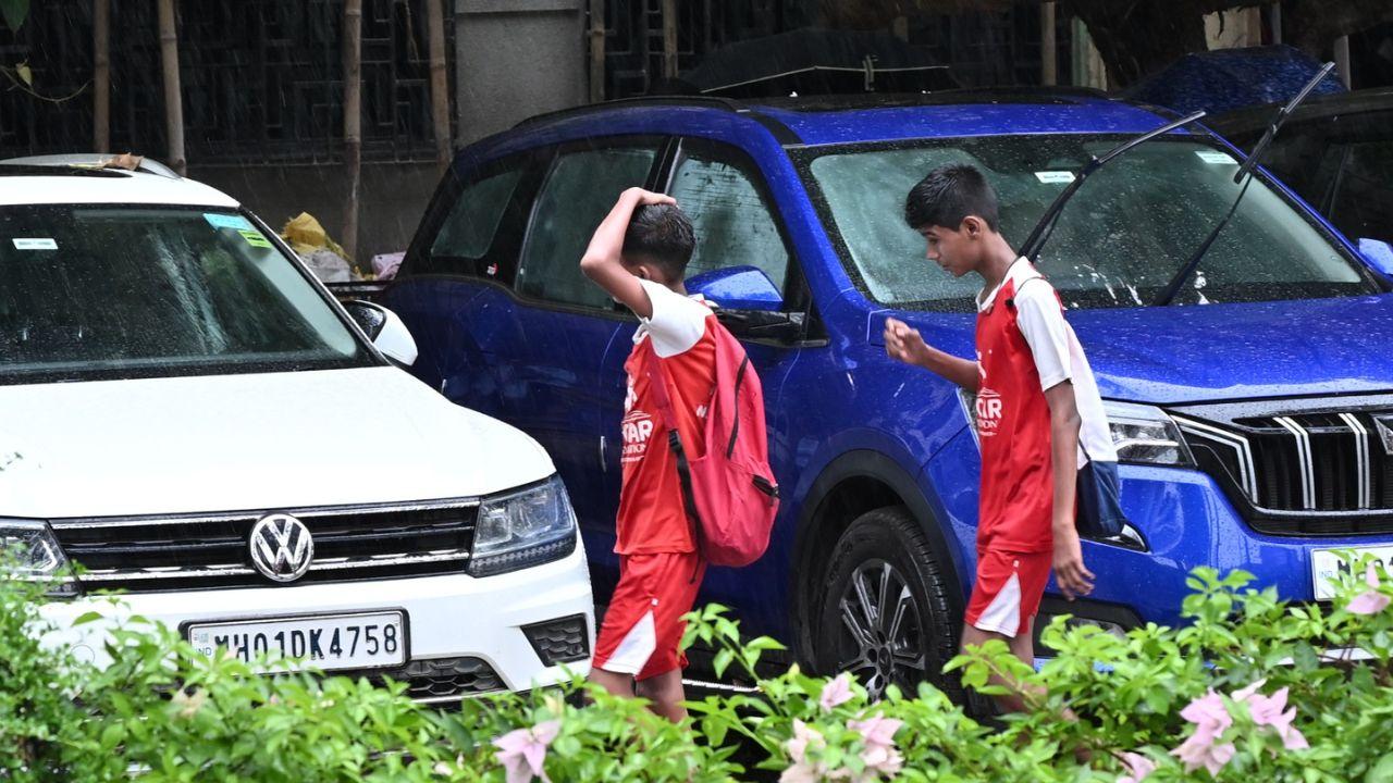 The children were seen rejoicing in the heavy rainfall as they headed back home from their schools.