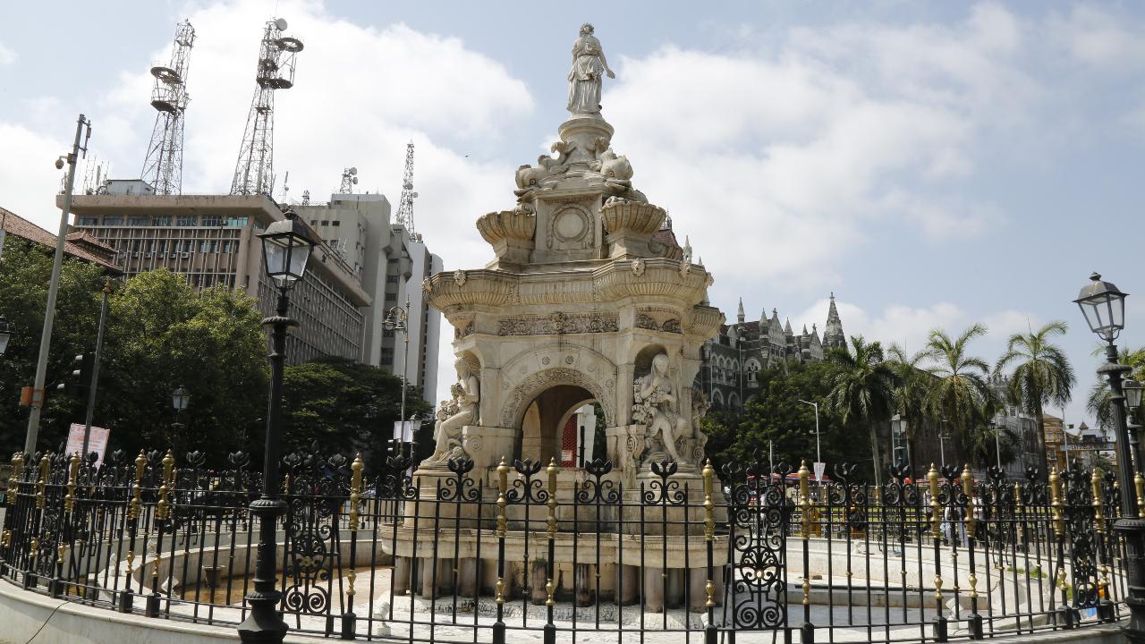 Flora Fountain, located in the heart of South Mumbai, is a historic architectural landmark that dates back to 1864. Named after the Roman goddess Flora, the fountain was built to commemorate the British colonial rule in India. Designed by Richard Norman Shaw and executed by James Forsythe, the fountain blends Neo-Gothic and Indo-Saracenic styles, reflecting the colonial era's architectural influences. It stands at the intersection of five major streets, once known as the Hutatma Chowk (Martyrs' Square) after the martyrs of the Samyukta Maharashtra Movement