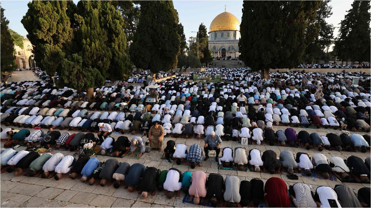 Palestinian Muslims perform the Eid al-Adha morning prayer at the Al-Aqsa mosques compound in Jerusalem