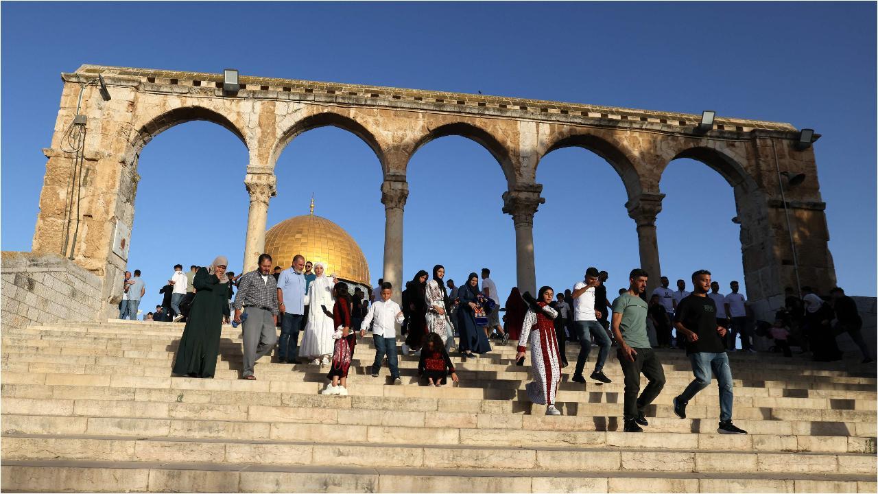 Palestinian Muslims perform the Eid al-Adha morning prayer at the Al-Aqsa mosques compound in Jerusalem, with the Dome of the Rock in the background. Image courtesy: AFP