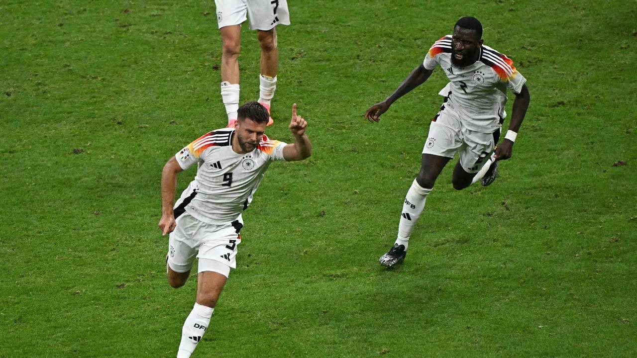 Last-gasp Niclas Fuellkrug goal rescues top spot for Euro hosts Germany