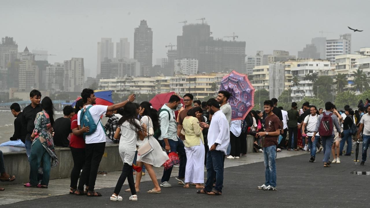 Mumbaikars were seen enjoying the rains at the city's sea-facing promenades of Marine Drive and Gateway of India