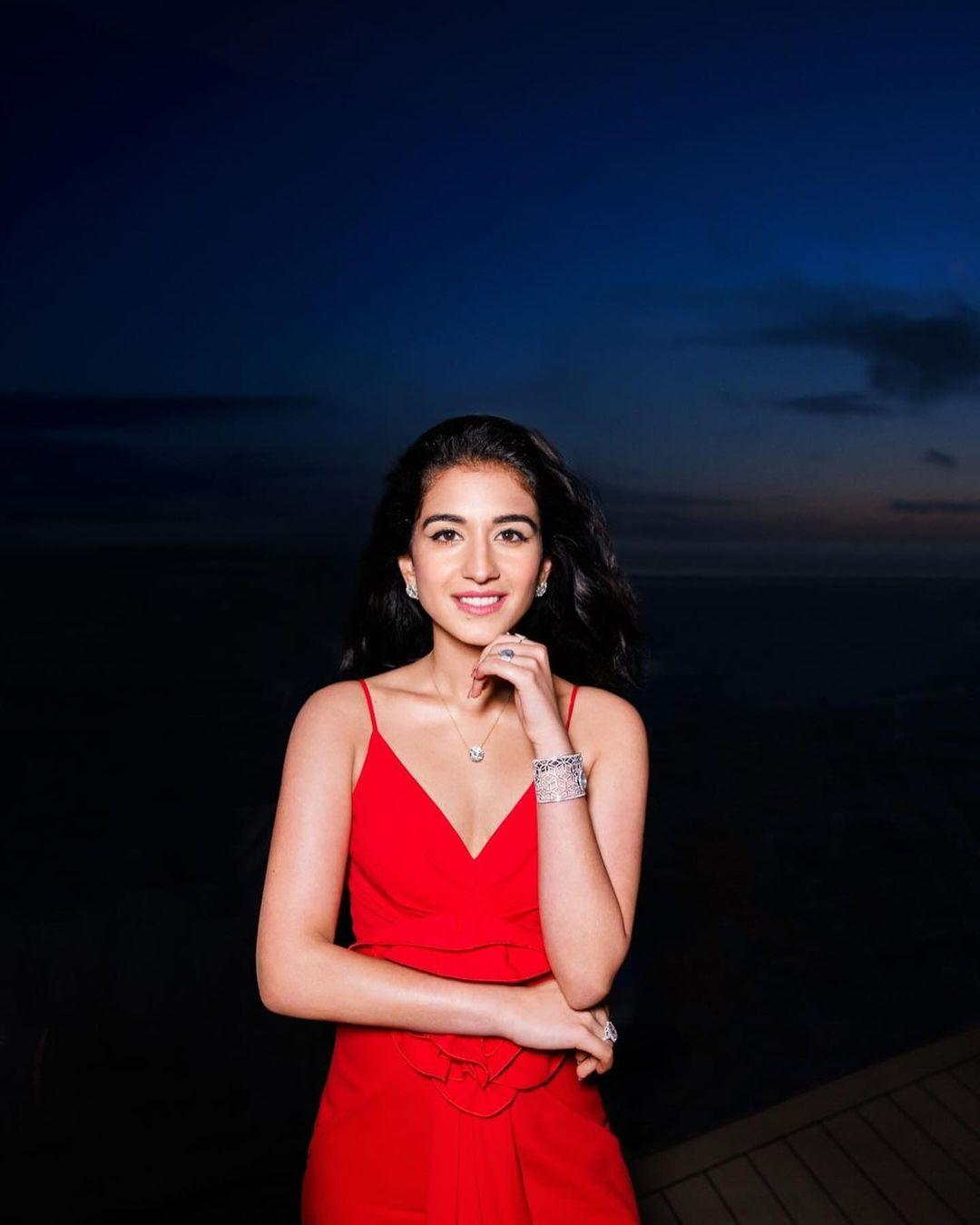 Radhika's outfit, in a bright red shade, makes the Balmain dress a perfect choice for a bride-to-be.