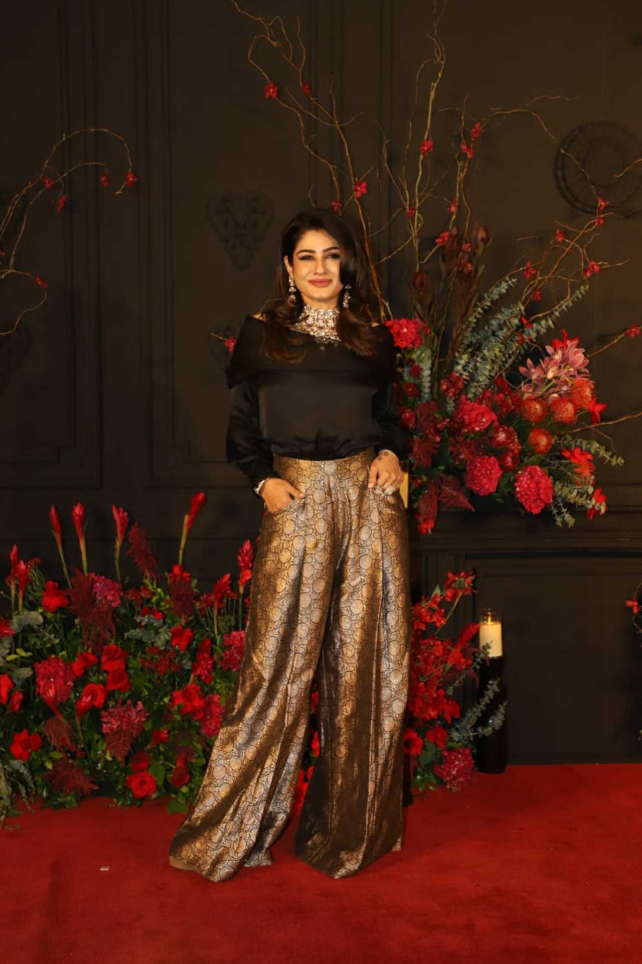 90s icon Raveena Tandon looked gorgeous in a black top and golden brocade co-ord set. 