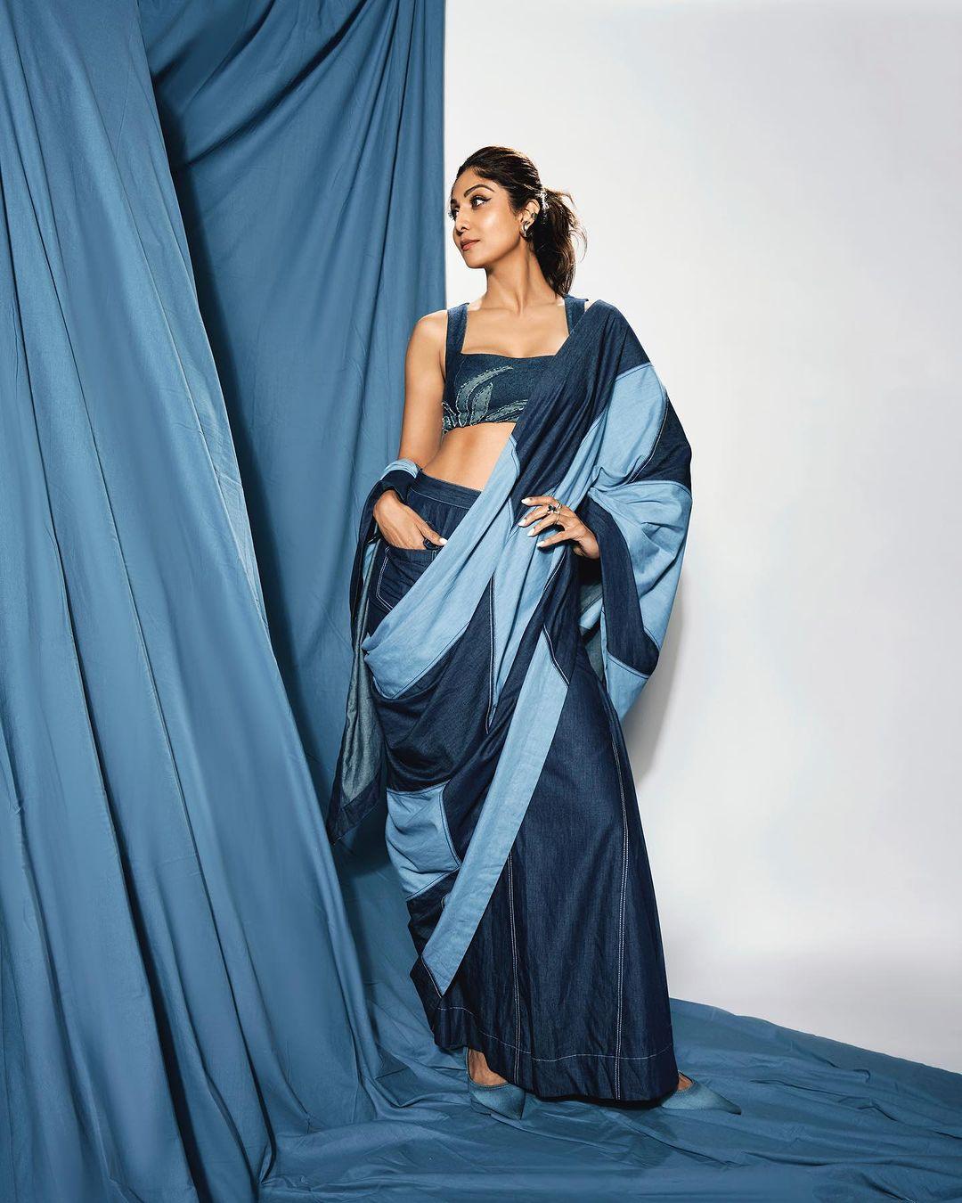 Embracing the denim trend with her usual confidence, Shilpa Shetty gives her classic look a boss lady vibe.