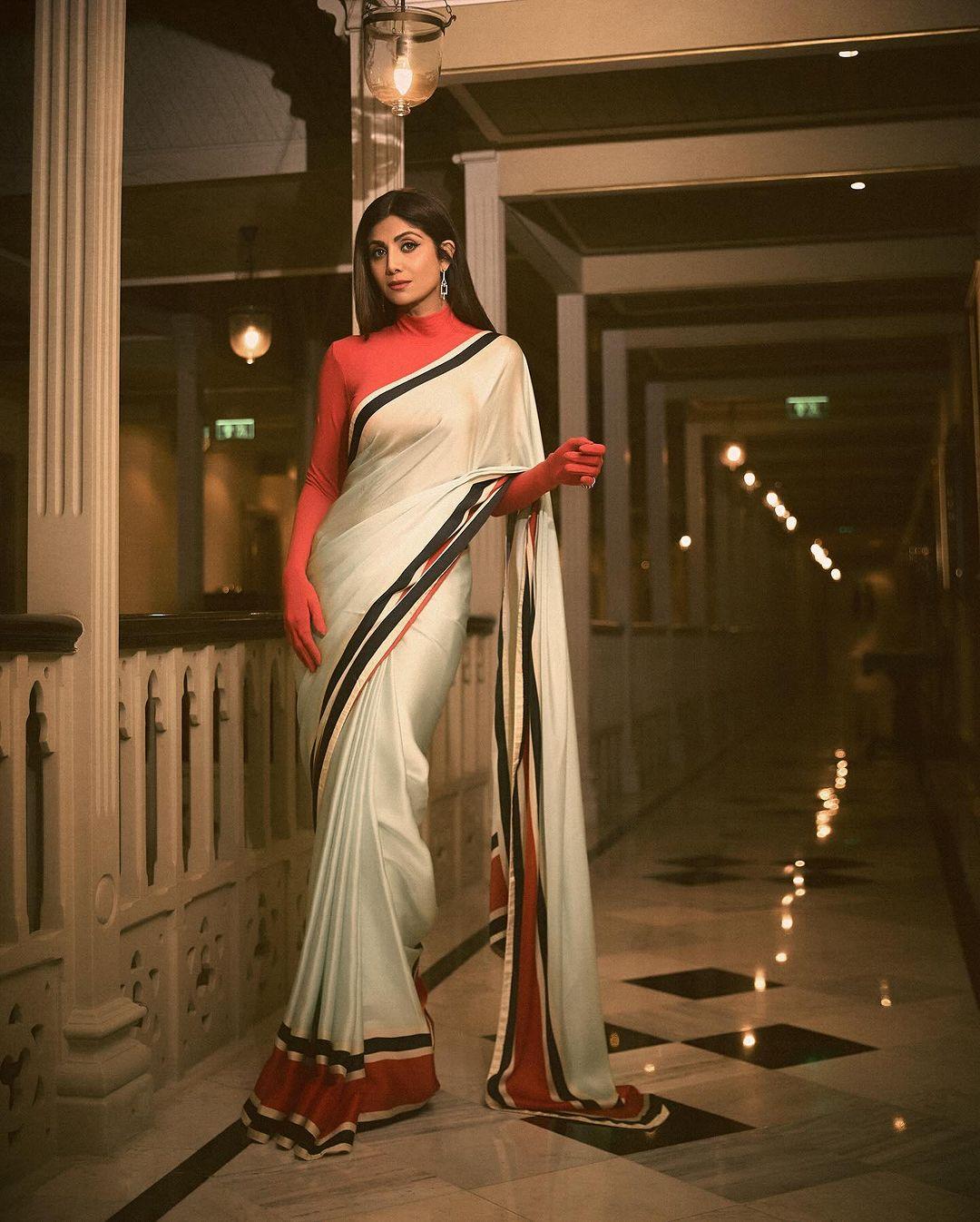 The outfit was simple yet elegant. The real twist, though, was her full-sleeved red blouse, which added a bold splash of colour.