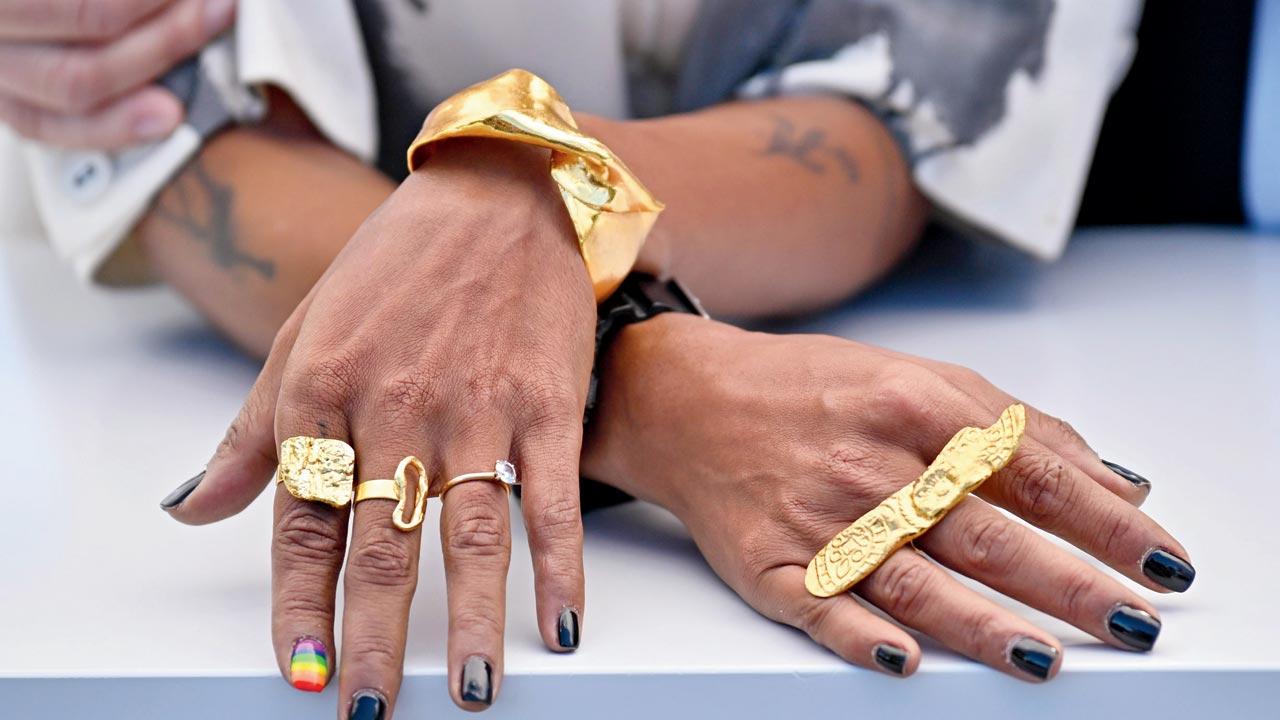 Anasuya Sengupta captures the zeitgeist with her left index finger painted in Pride colours, complemented by conceptual jewellery from Studio Kassa and Studio Metallurgy