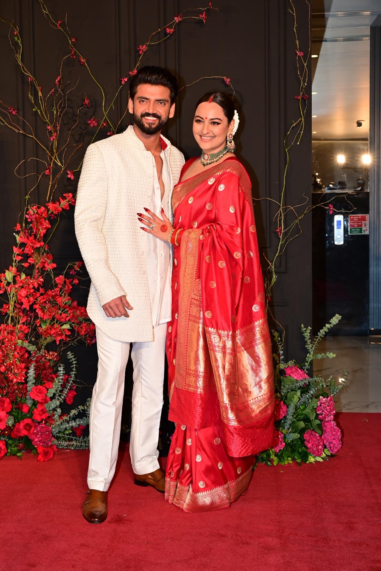 The newlyweds changed into different outfits for the reception. Sonakshi looked regal as a bride in a red saree with bindi and vermillion, while Zaheer kept it simple in a white kurta. 