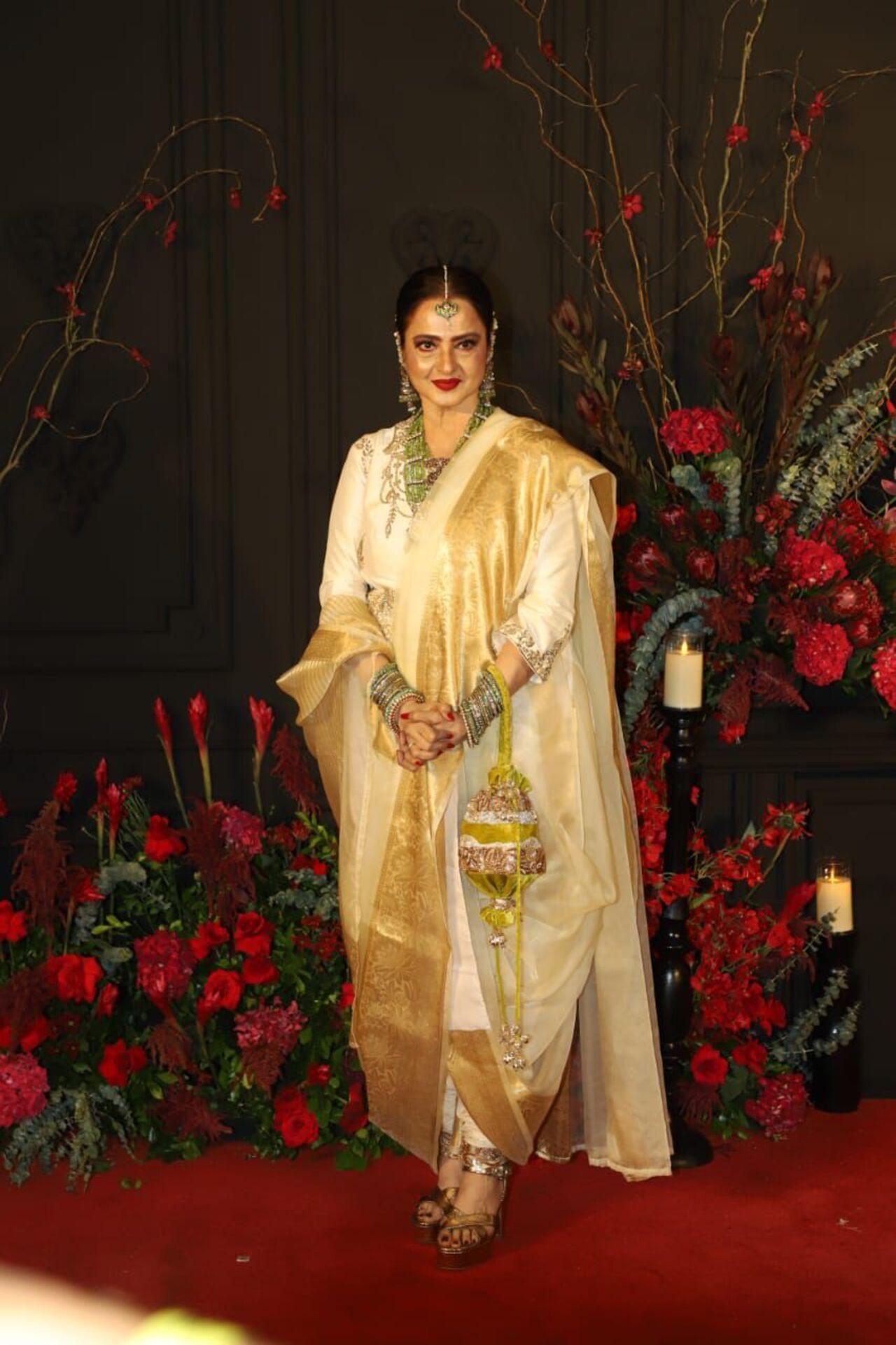 Veteran star Rekha commanded attention in a white and golden traditional ensemble. 