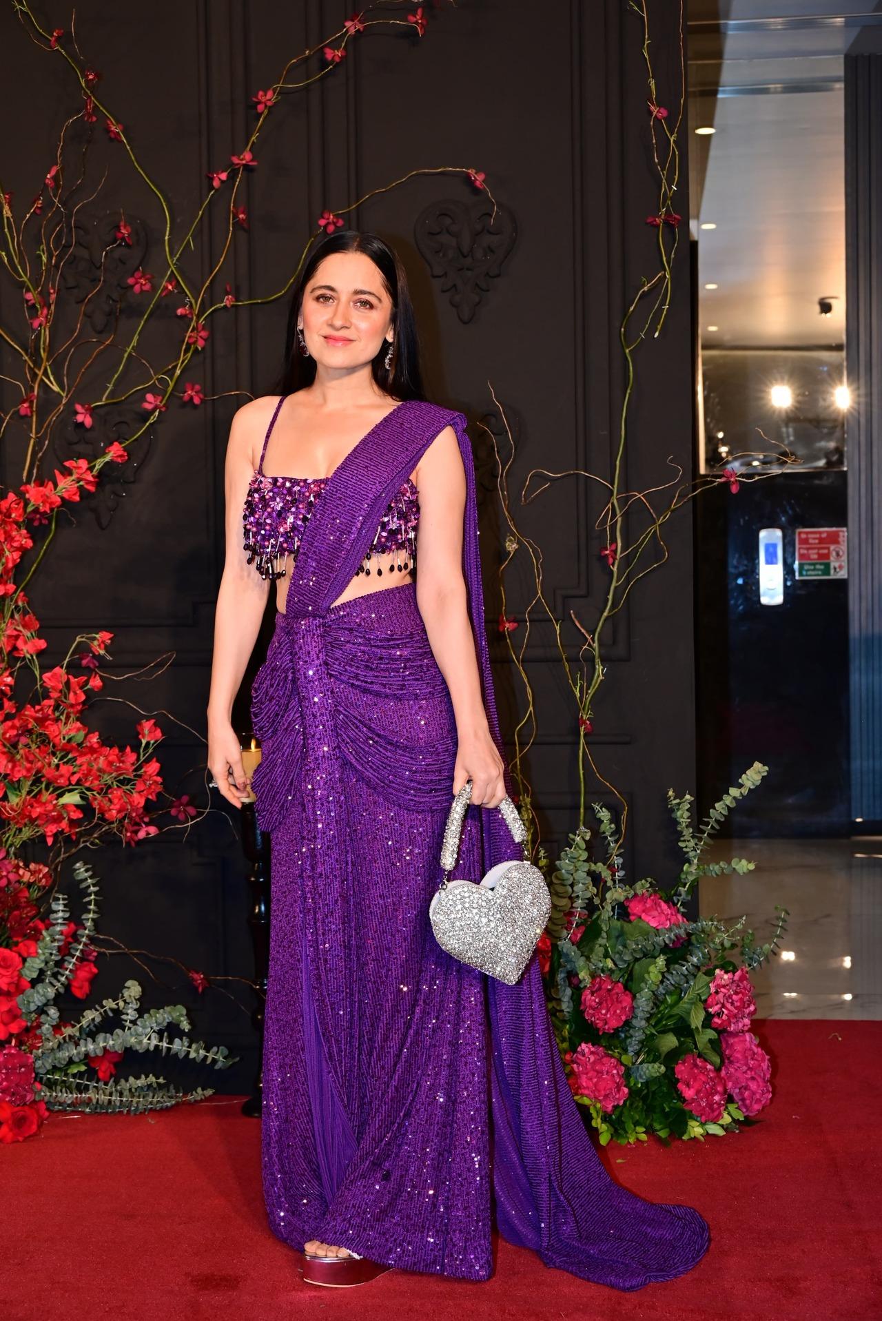 Actress Sanjeeda Shaikh arrived wearing a shimmery purple saree that was in the shape of a draped vintage outfit. 