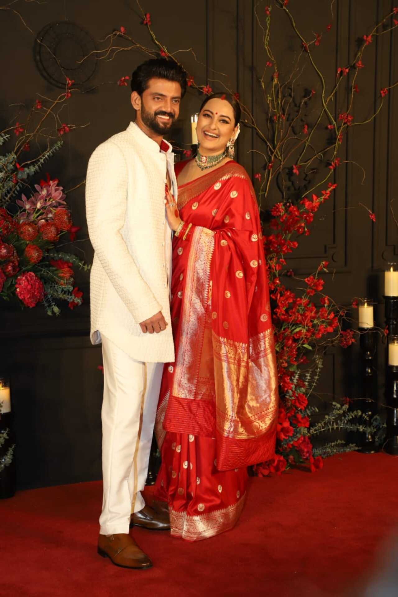 At the wedding reception, Sonakshi wore a red-coloured silk saree. The groom Zaheer looked handsome in a white Sherwani, beaming with joy on his special day