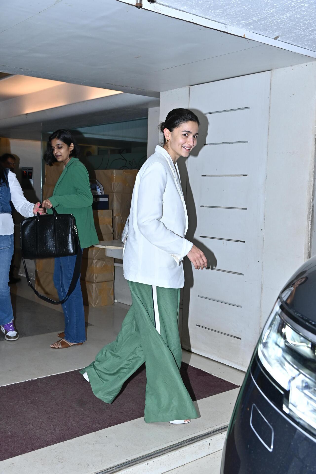 Alia Bhatt also made a stylish appearance in a white and green pant suit as she headed out for work. 