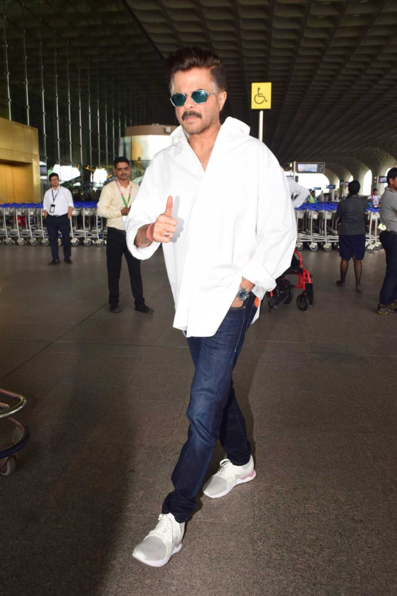 'Bigg Boss OTT 3' host Anil Kapoor gave a thumbs up after he was photographed at the Mumbai airport. 