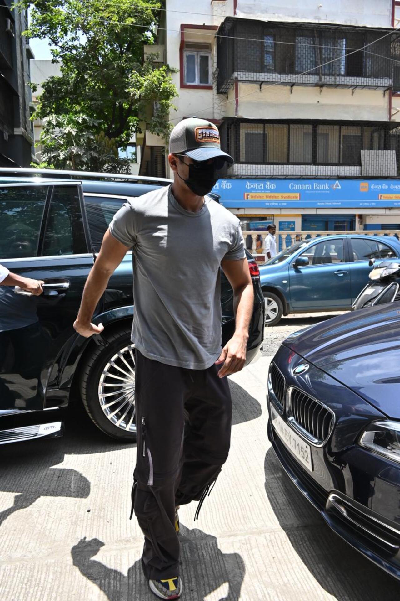 Shahid Kapoor was seen in a mask as he stepped out of his car flaunting his buffed physique. 