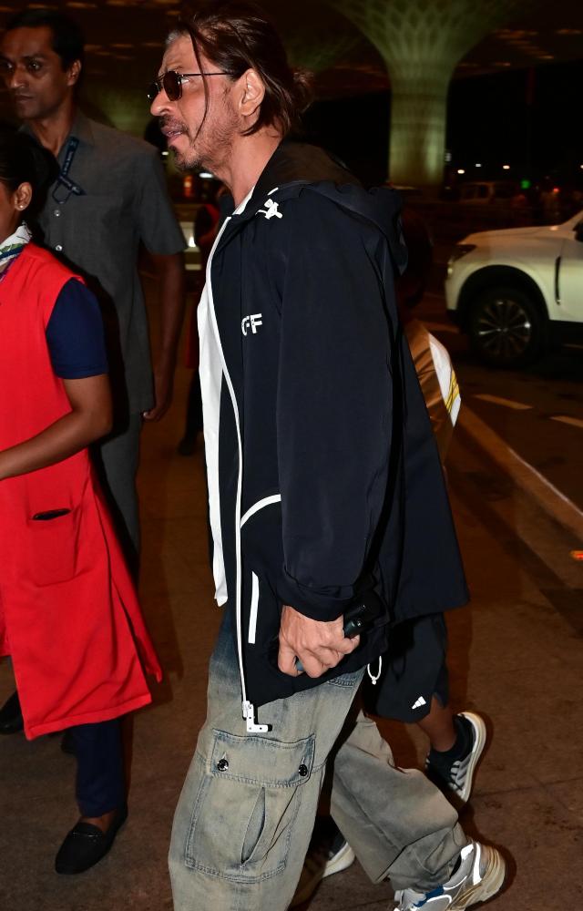 His latest look featured a white oversized shirt with long sleeves and a collar.