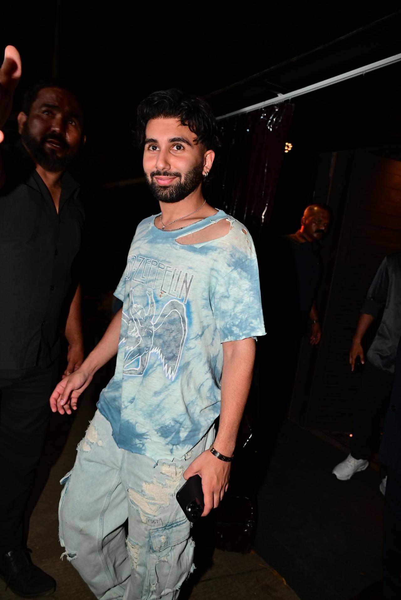 Orry was seen in a distressed t-shirt and pants for the party. He smiled and posed for the paparazzi before heading in