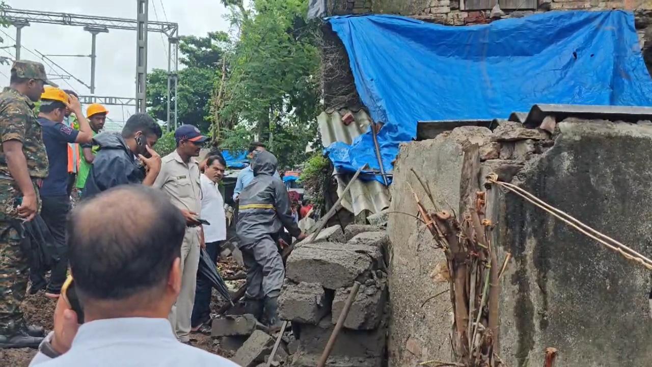 The wall fell on a pedestrian who was passing by on an adjacent road, injuring him, he said