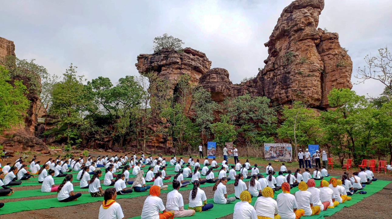 Raisen: Women take part in a mass yoga session organised to mark the 10th International Day of Yoga at thke UNESCO site Bhimbetka, in Raisen district of Madhya Pradesh