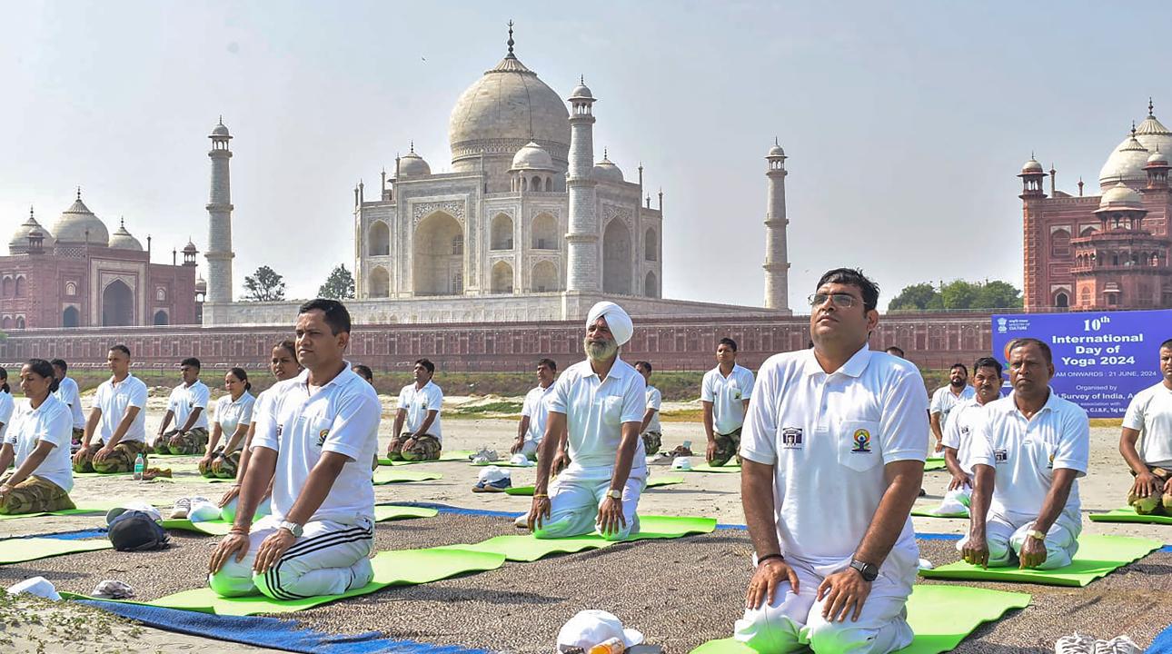 Agra: CISF personnel perform Yoga near the Taj Mahal. This day is celebrated worldwide with yoga sessions, workshops and cultural performances organised in various countries