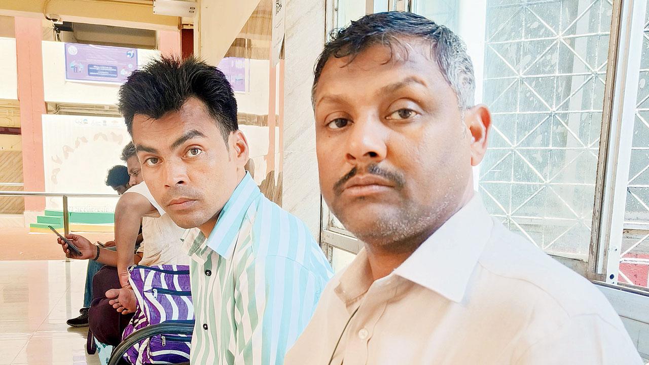 Arsad Ali (left) has 100 per cent hearing disability seen with his brother-in-law