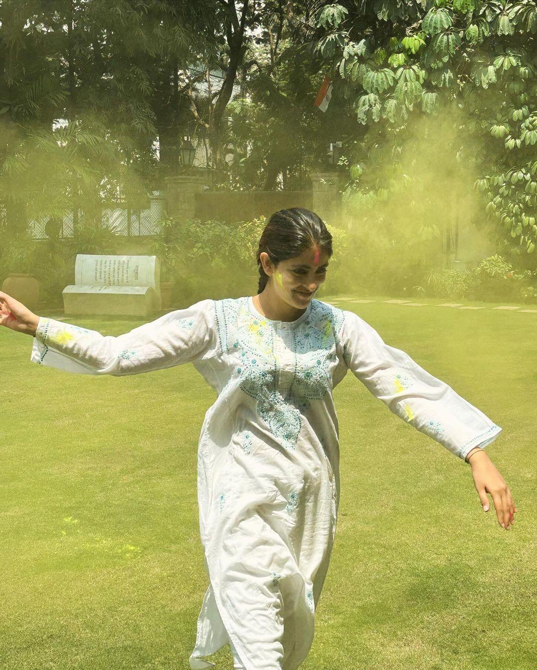 It looks like Navya had the time of her life this year at the Holi celebration. In this snap, Navya was seen running as the backdrop looked filled with colours
