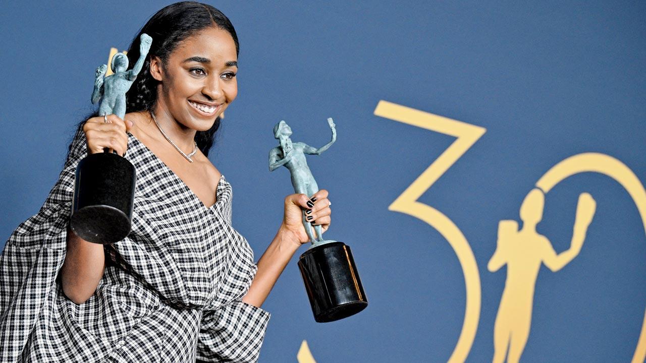 US actress Ayo Edebiri poses with the awards for Outstanding Performance by a Female Actor in a Comedy Series and Outstanding Performance by an Ensemble in a Comedy Series for Hulu’s The Bear during the 30th Annual Screen Actors Guild awards at the Shrine Auditorium in Los Angeles on February 24. She’s wearing a monochrome Madras checks ensemble by Luar. Pic/Getty Images