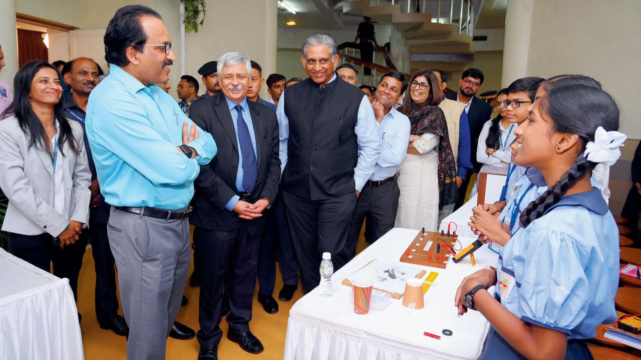 ISRO chairman S Somanath interacts with students; (below) Chadrayaan-3 model 