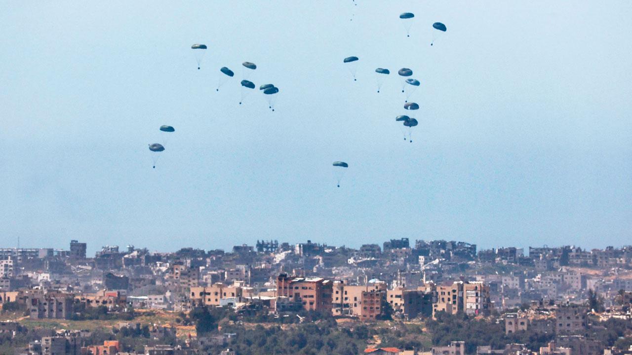 Humanitarian aid being airdropped over the Palestinian territory, on March 13. Pics/AP