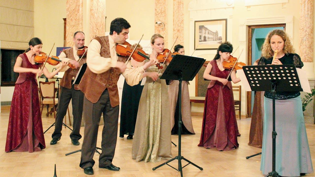 Giorgi Kerelashvili (centre) plays the violin at a Baroque showcase 