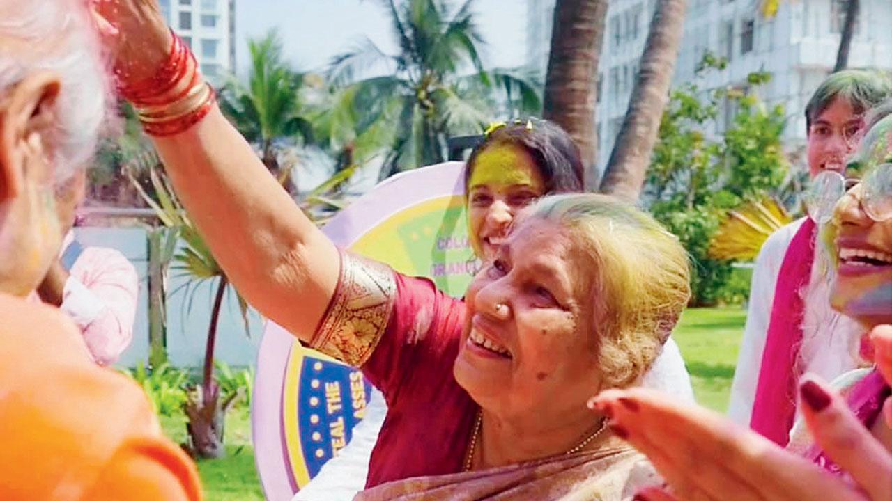 Senior citizens play with colours at the celebrations in Bandra 