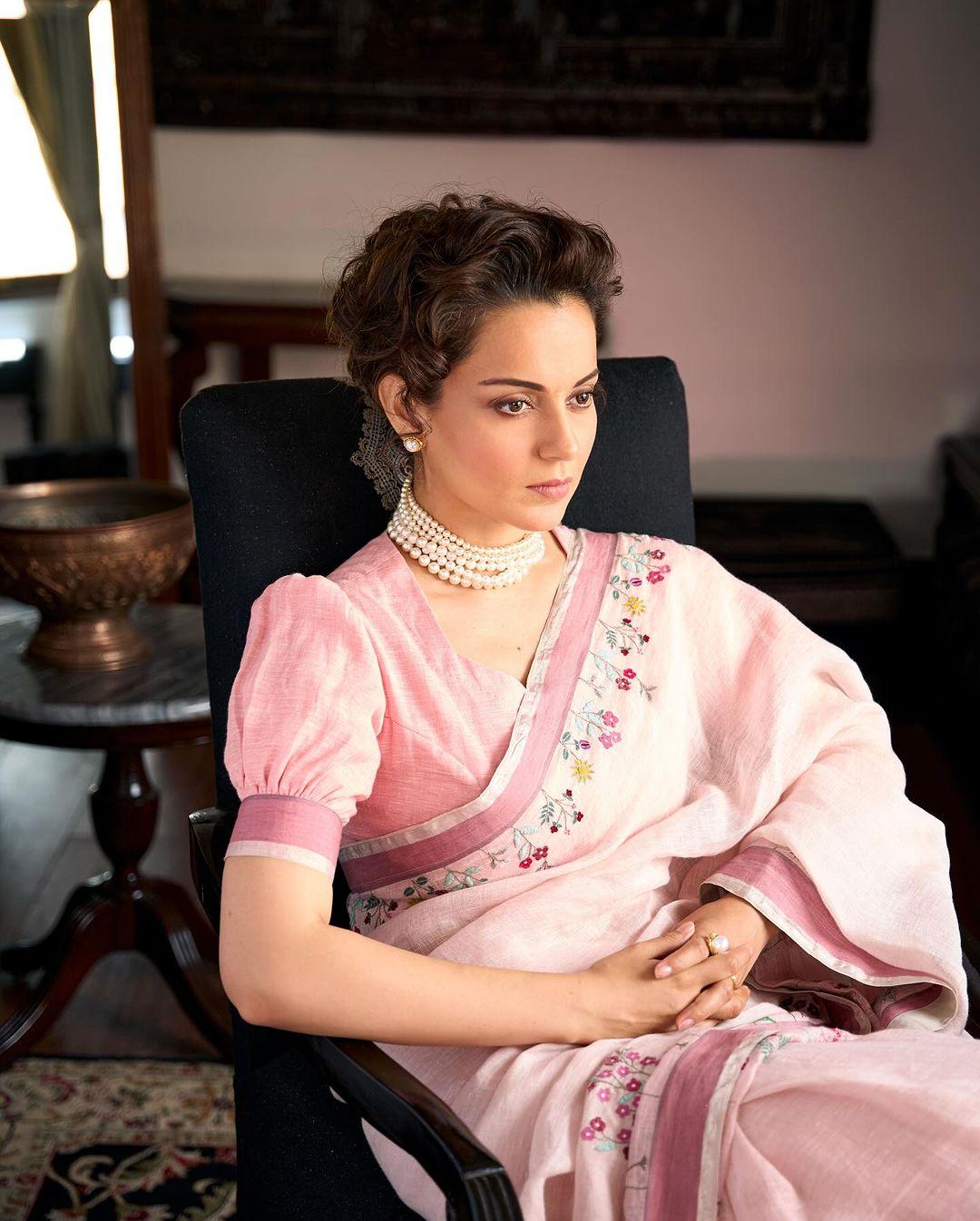 Kangana wore a pearl necklace to enhance her look while she tied her hair in a messy bun to finish her stylish look