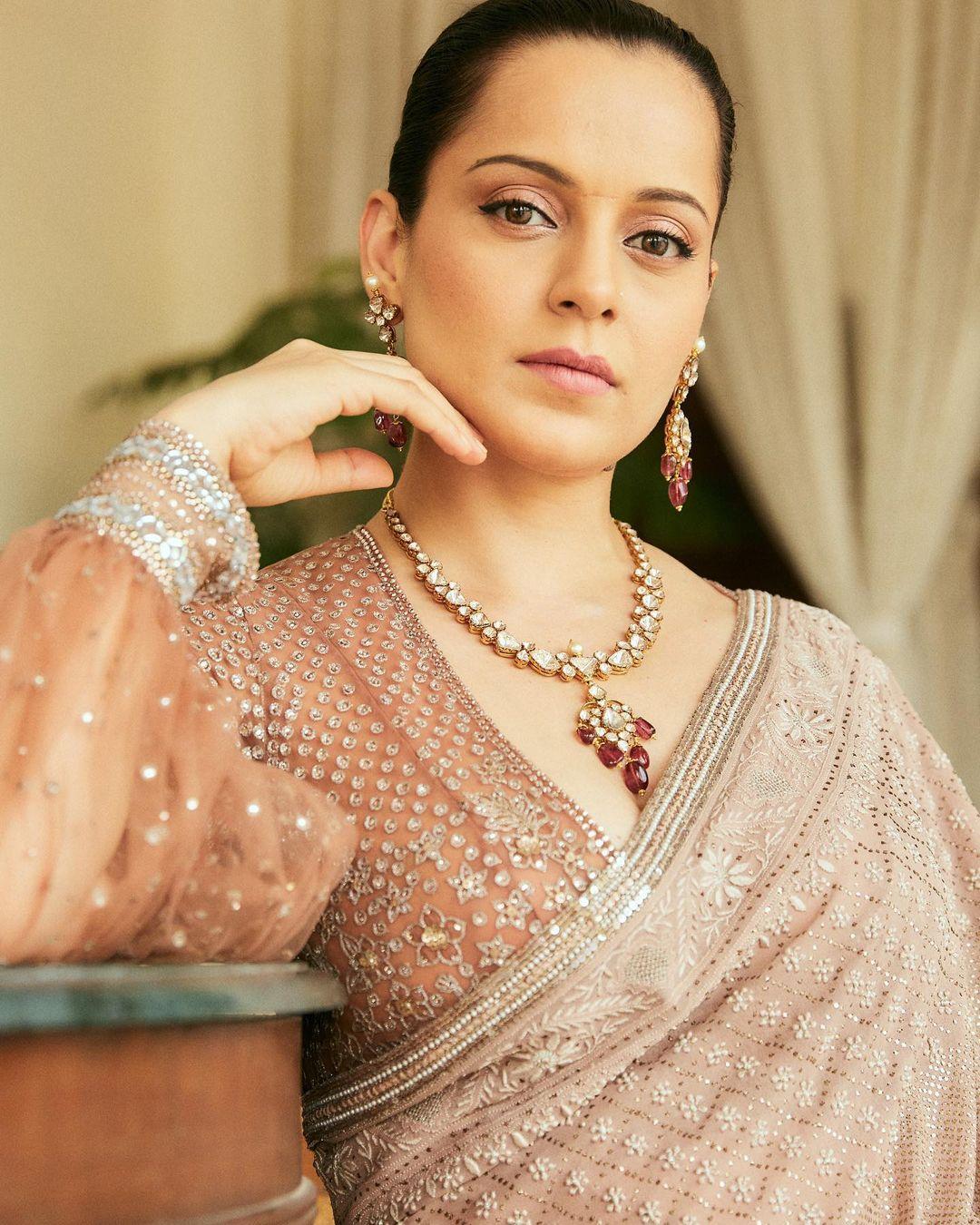Kangana's blouse with sheer sleeves stole the spotlight. This look of the actress is perfect to ace your look on any occasion, be it a family function or a friend's wedding