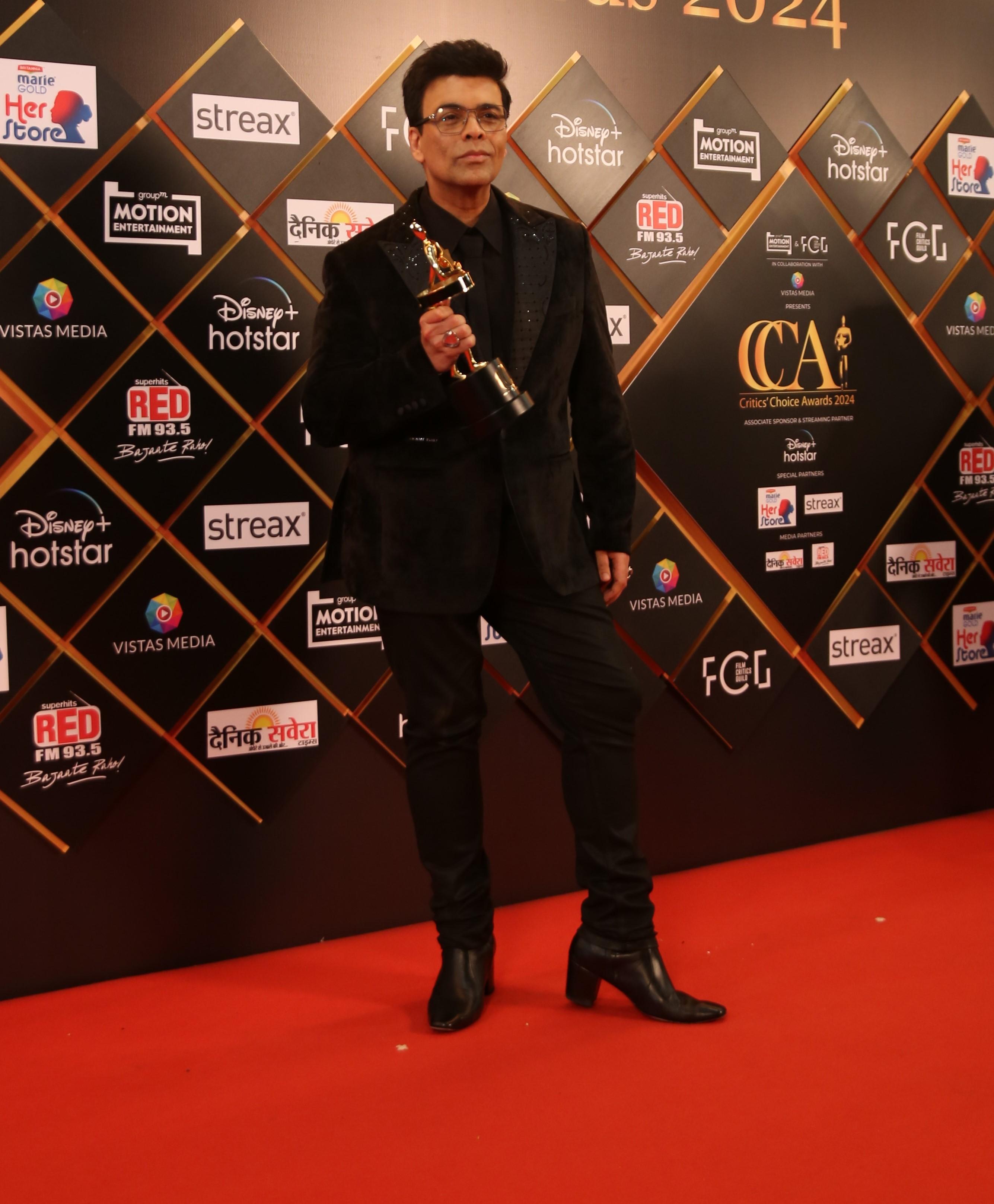 Karan Johar looked dapper as he served a few poses for the paparazzi to grab