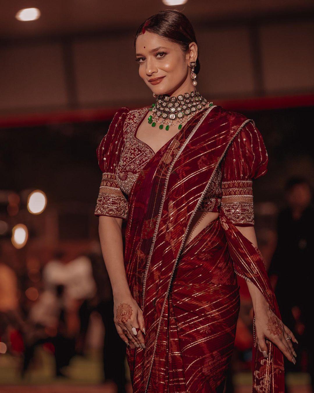 Ankita Lokhande opted for a stunning maroon-coloured saree and paired it with a heavy blouse. The puffed sleeves of the blouse elevated her entire look. If you are planning to wear a saree this Mahashivratri pooja then you have found your perfect match