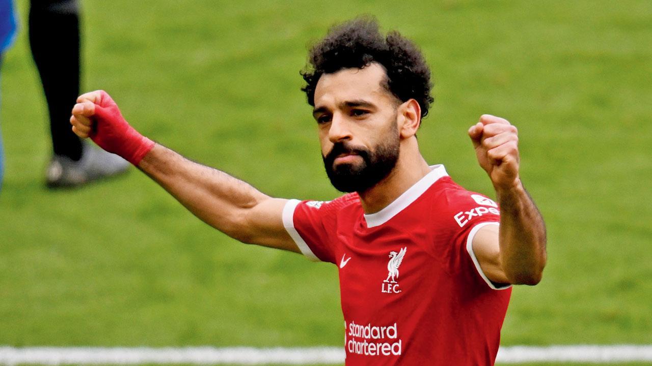 Salah fires Liverpool to the top