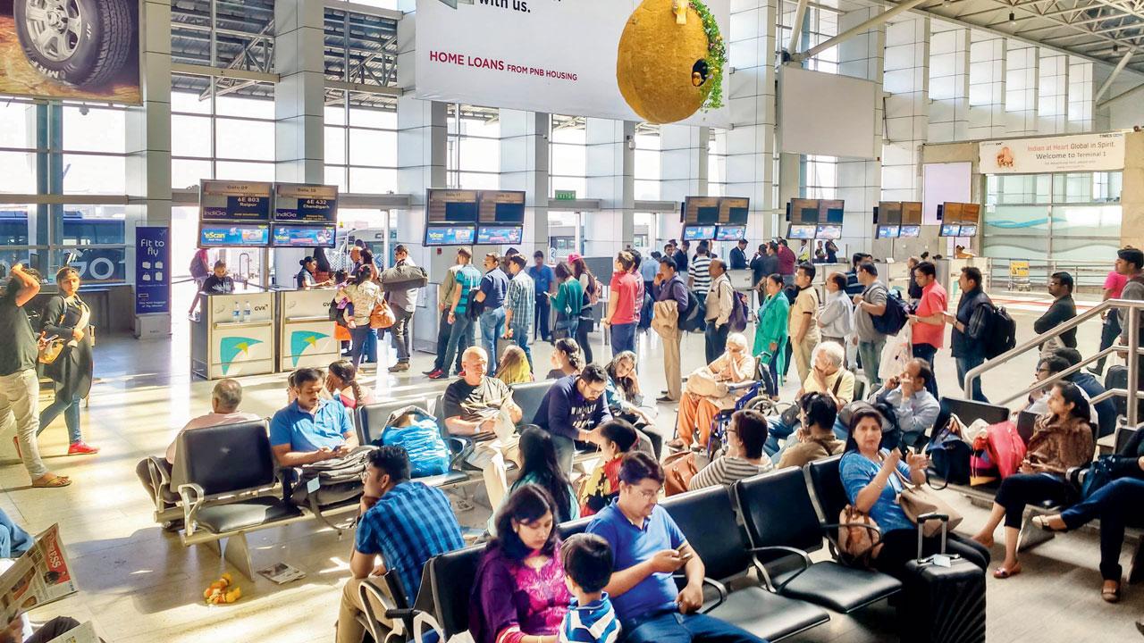 People queue up to board a domestic flight while others wait for their flights at T2. File pic