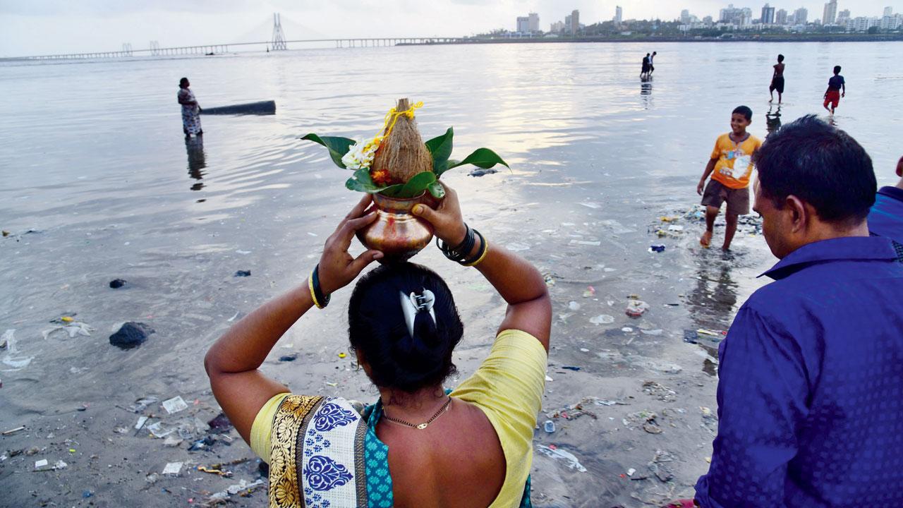 A fisherwoman participates in the rituals on the festival in Mahim Koliwada. File Pics