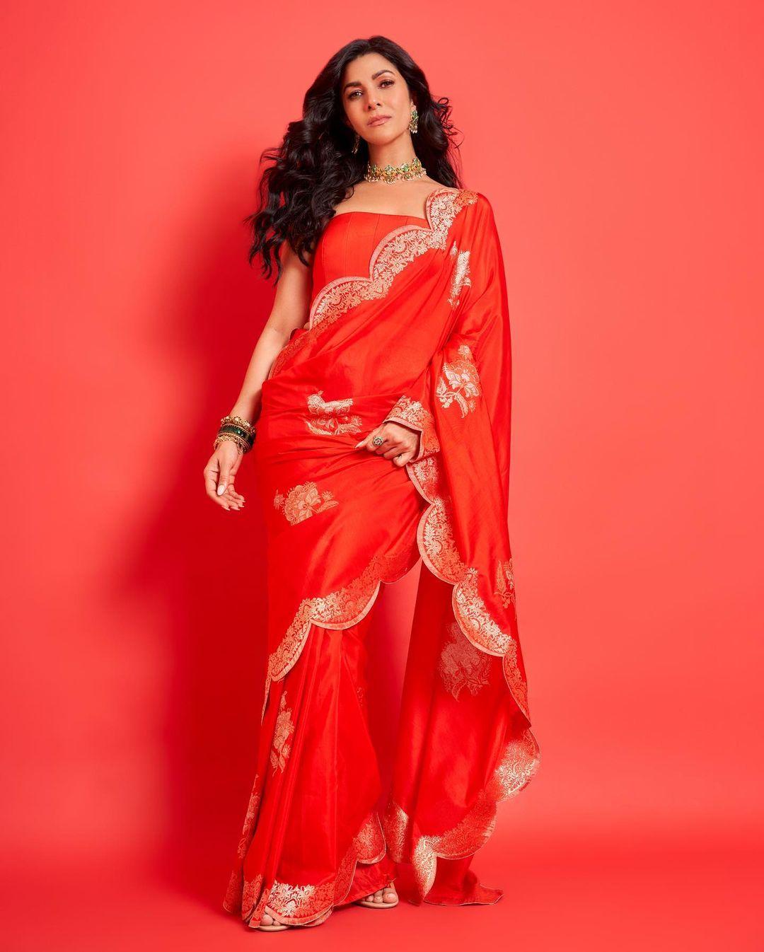 Sarees are your best friend if you want an easy yet stylish outfit to ace a grand iftar party. In this look, Nimrat wore a sheer red saree and paired it with a matching blouse