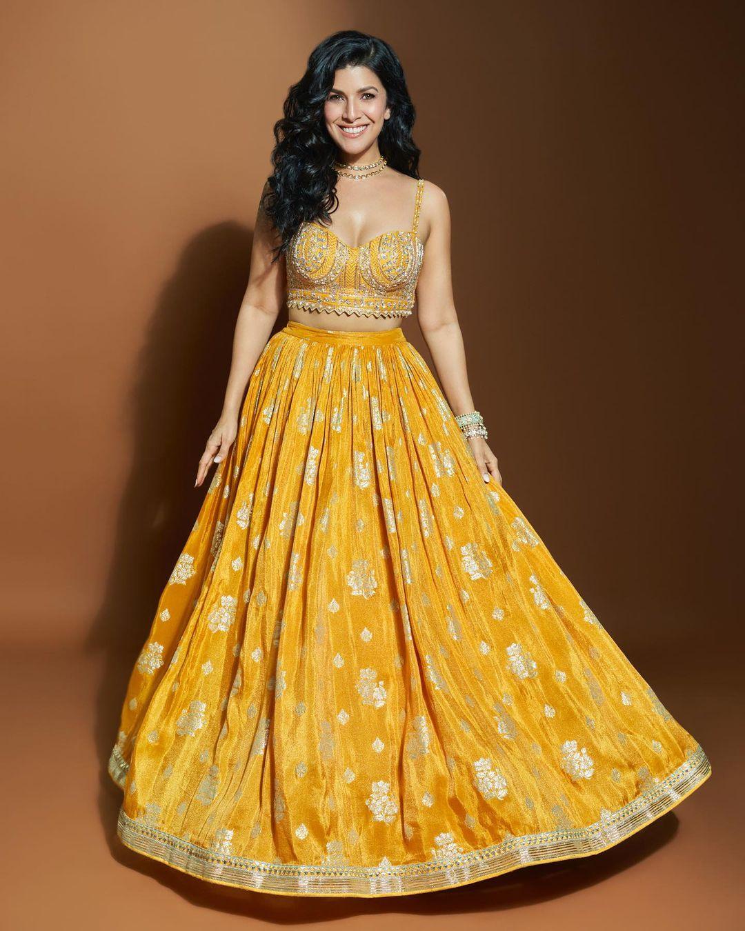 Nimrat Kaur is a queen when it comes to styling a lehenga. In this look, Nimrat looked like a sunflower in a stunning lehenga set