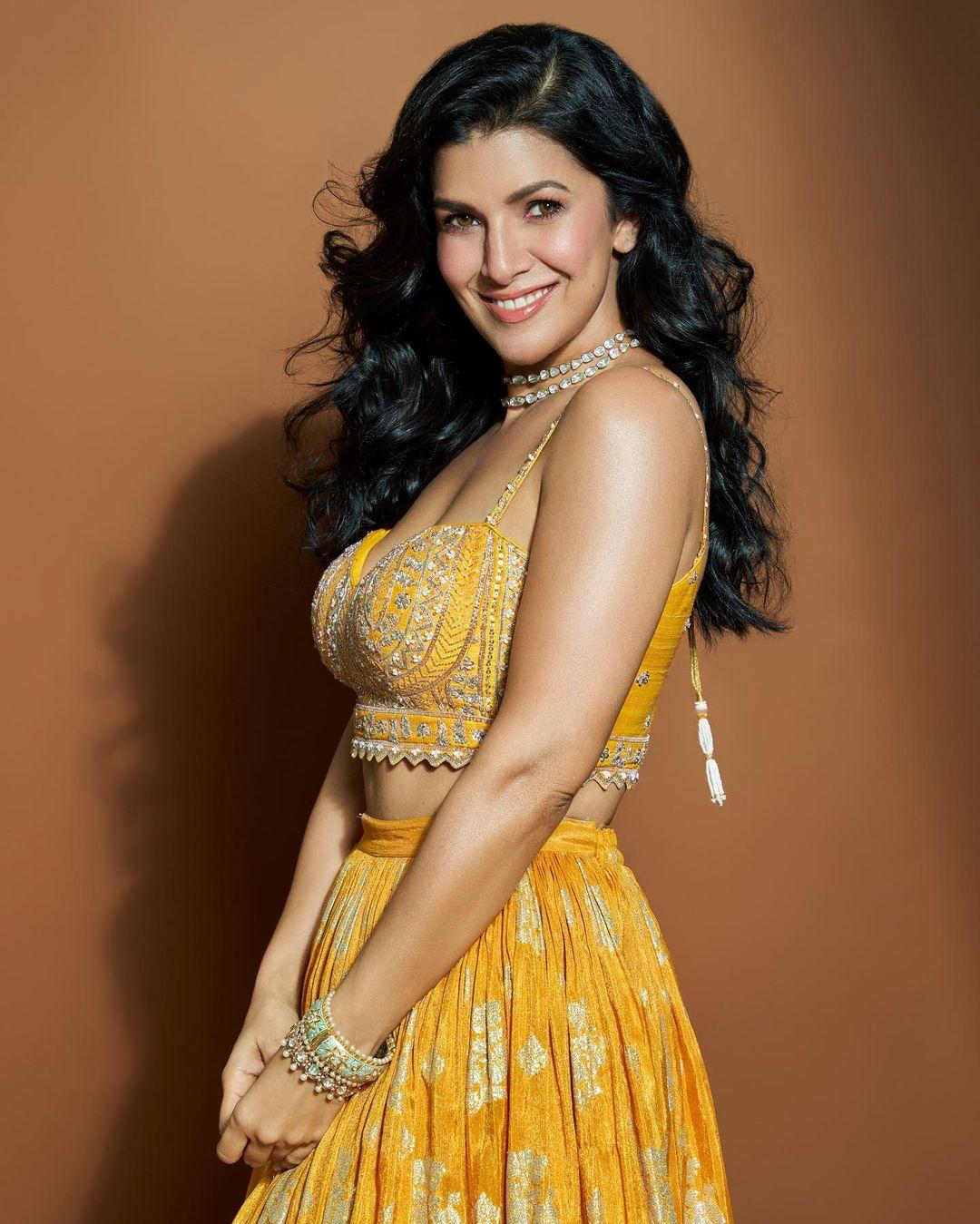 The actress wore a stunning yellow lehenga with golden embroidery and paired it with a matching blouse