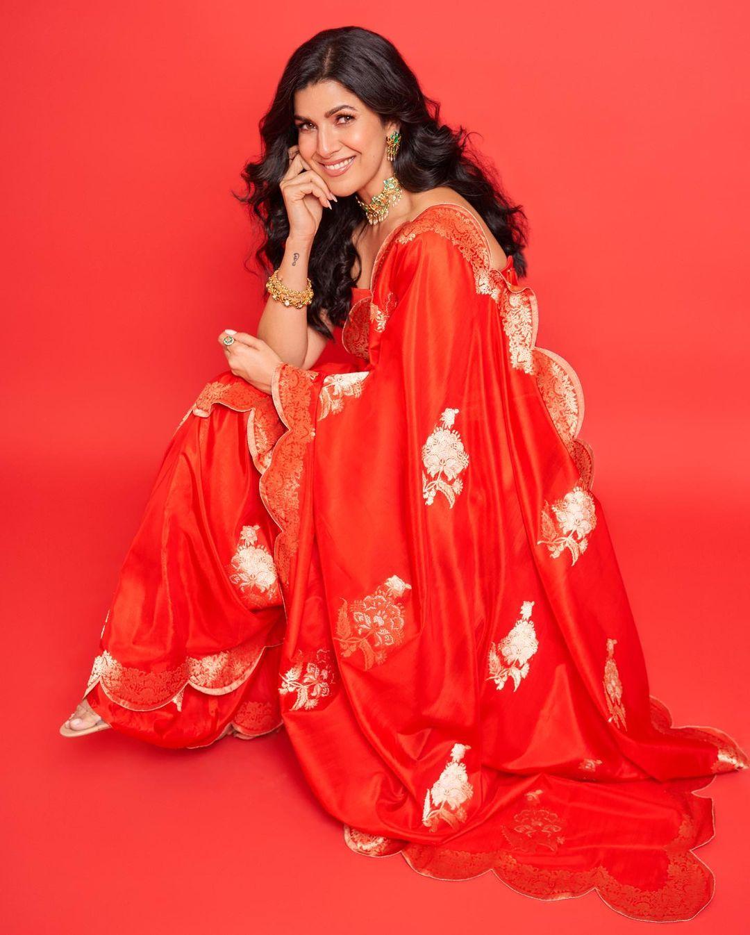  Her saree has golden designs printed over it. She finished her look with a stylish necklace set that has a hint of contrast with the green colour