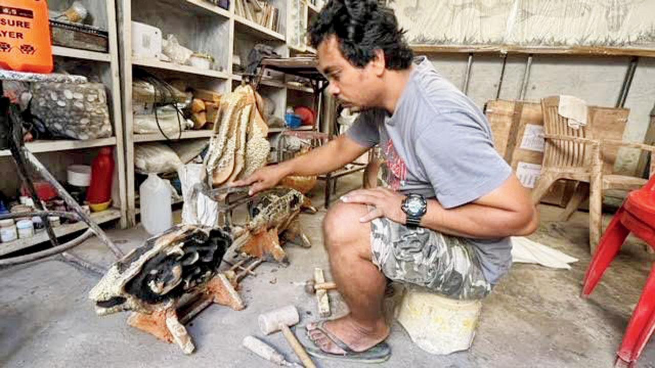 Parag Tandel works on a sculpture at his studio in Thane