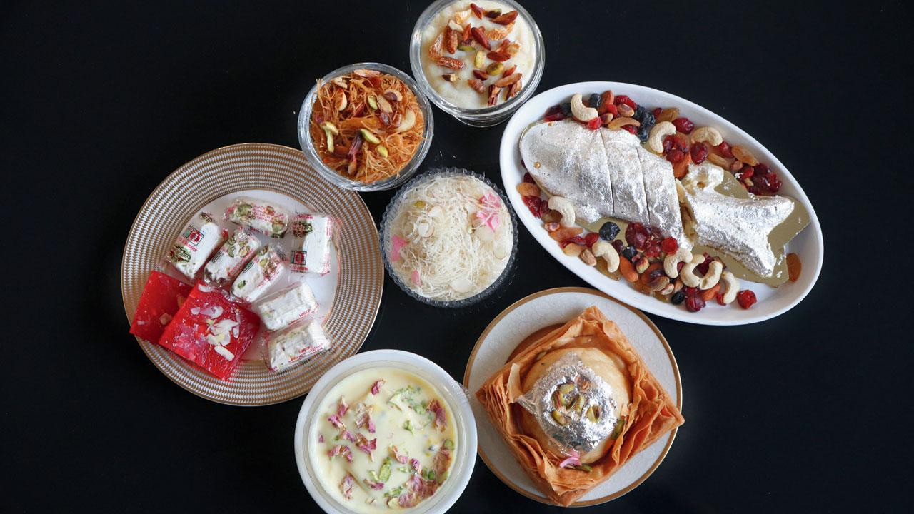 A spread of Noshir Sanjana’s favourite Parsi sweets including chikat halva, bread pudding, malai khaja, mawa ni boi, ravo, sev,  sutarfeni, and gaz. Pics/Anurag Ahire