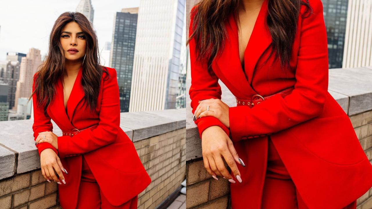 Priyanka Chopra Jonas rocked this bold red pantsuit for her movie 'The Matrix Resurrections' promotions and left everyone gasping. Chopra’s fiery tailored blazer and long, billowy trousers are fresh off the runway from Sergio Hudson’s fall 2021 collection