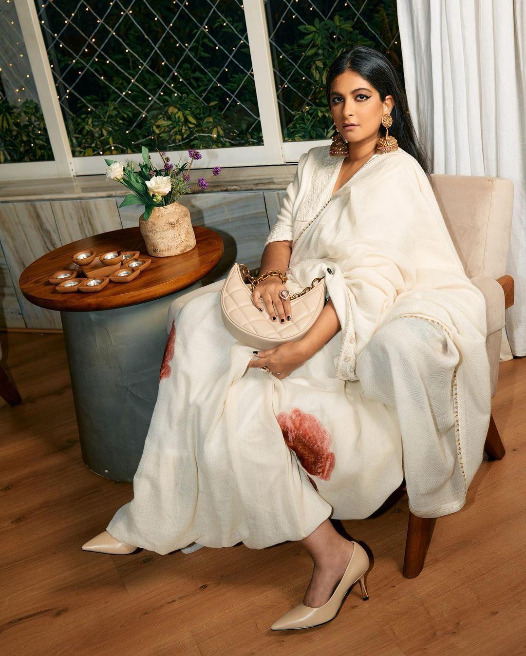 A family wedding, and you want to wear white, but Mom has said no? Worry not; we've got you covered. We have a white dress for you that you can defend because it has a touch of maroon and green
