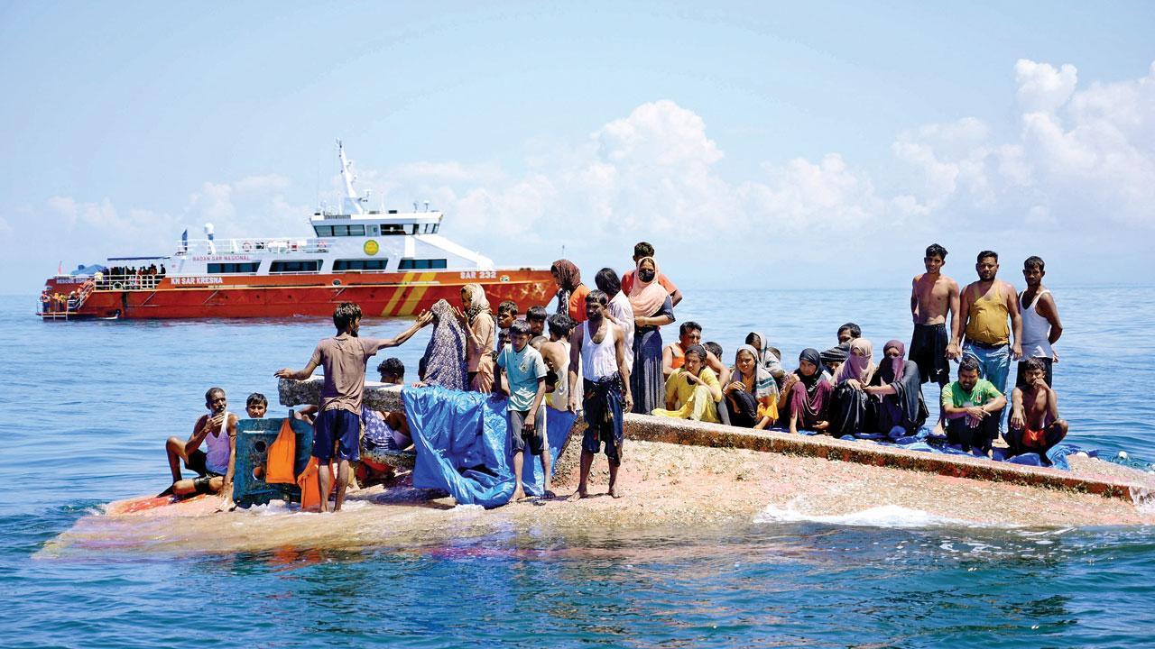 Rohingya refugees rescued from hull of capsized boat