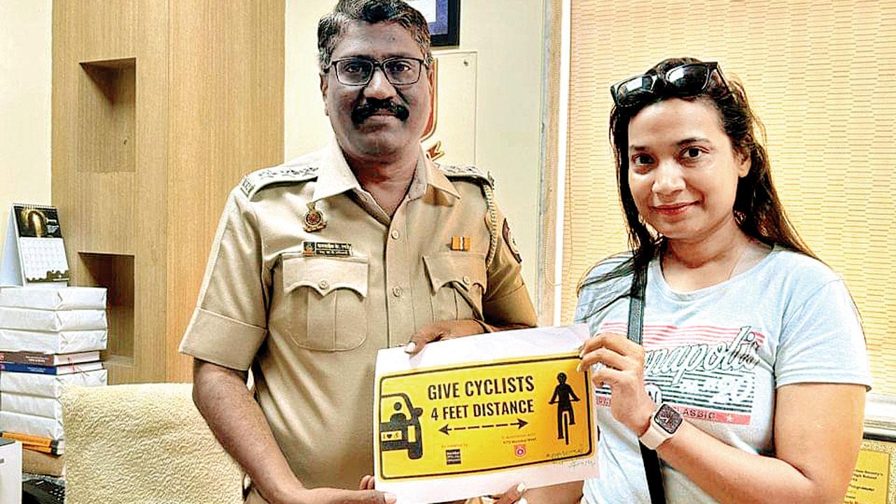 Saini and an RTO officer with the approved sticker