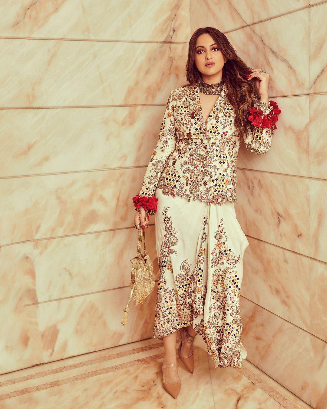 In this look, Sonakshi Sinha wore a stunning white heavily embroidered outfit, perfect for an Indo-western look