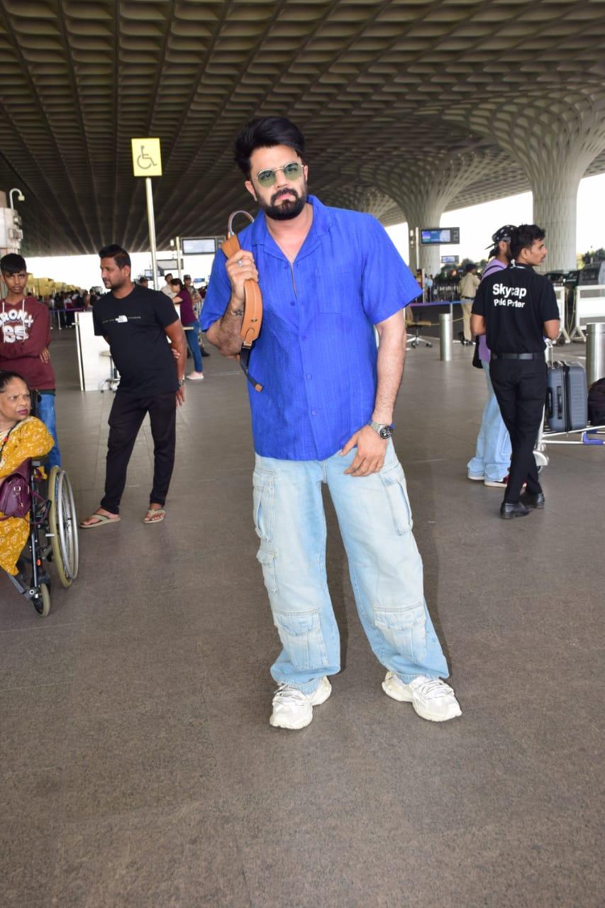 Maniesh Paul wore a blue shirt and paired it with matching jeans for his comfy and casual airport look